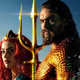 Amber Heard and Jason Momoa strike a dramatic, sunlit moment in the first Aquaman film.